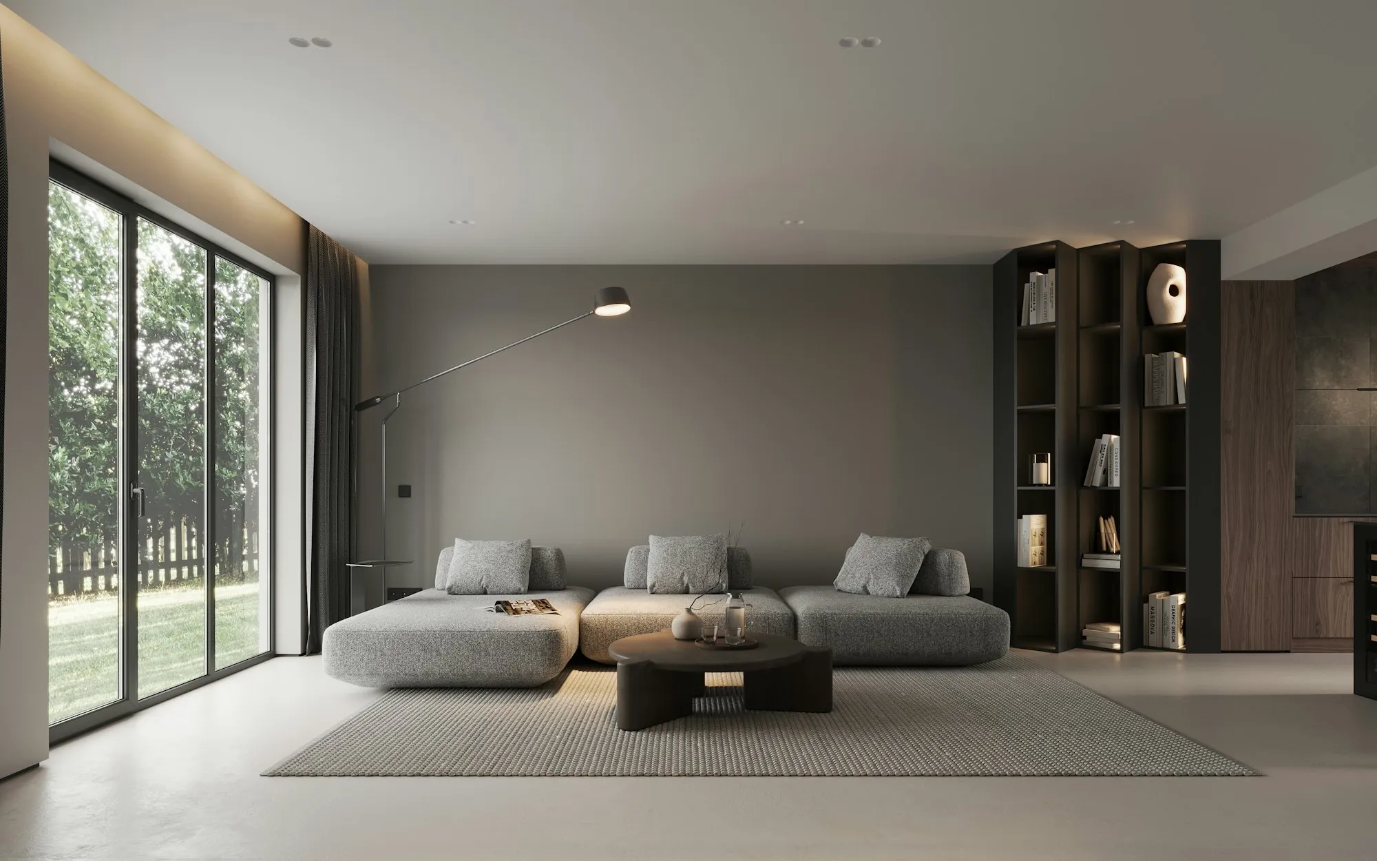 Calm modern living room with a low linen sofa and floor-to-ceiling garden windows