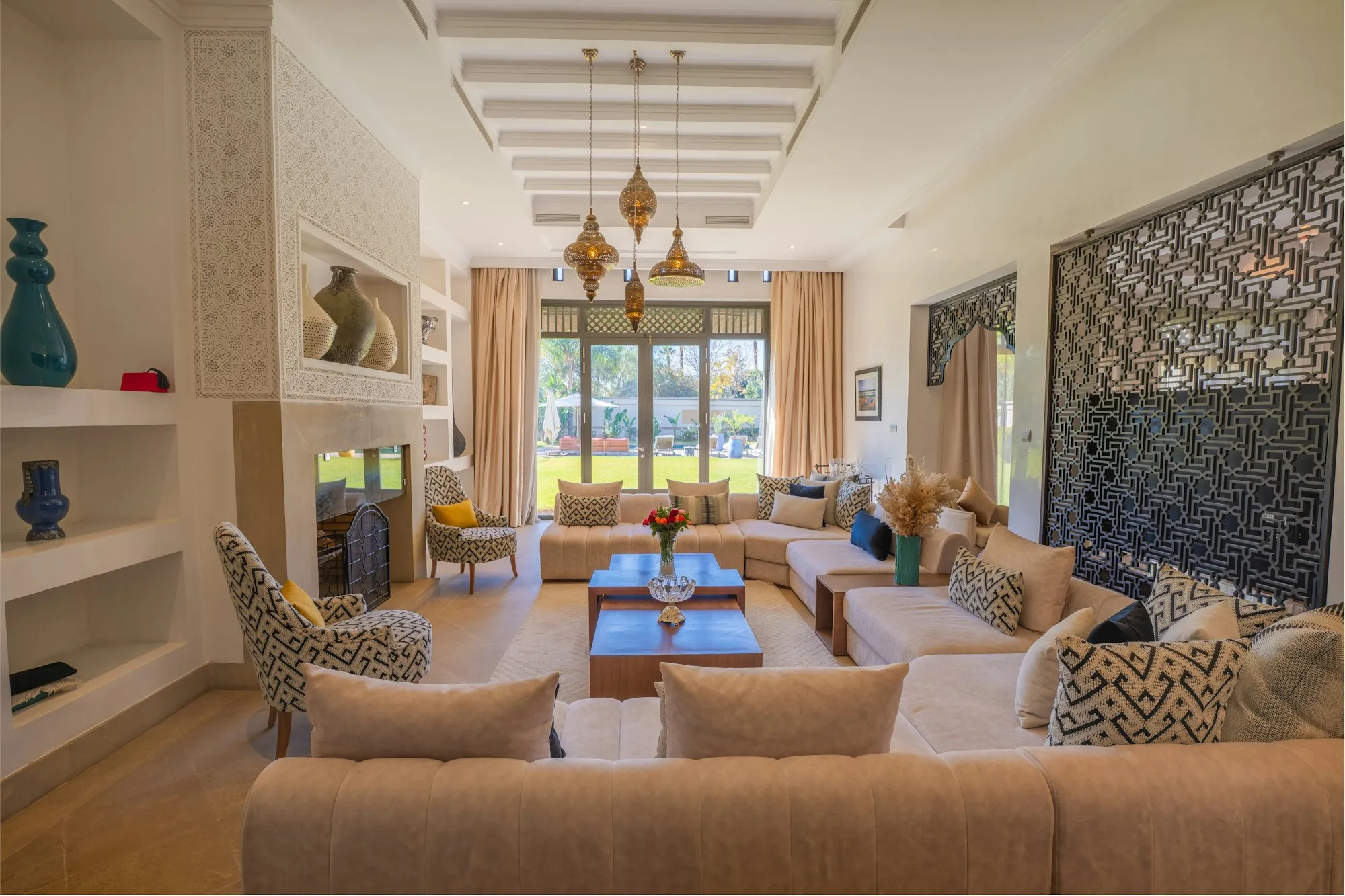 Living room with carved timber screen and garden view